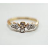 A 1920's 18ct, plat and six stone diamond chip set cluster ring, size M, gross weight 2.5 grams.