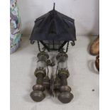 A pair of GWR railway lamps and a wrought iron hanging lantern, largest each 35cm high