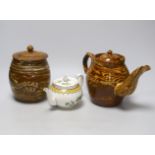 A late 19th century Scottish agate ware teapot and a sugar barrel and a Harrods Stella teapot,
