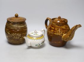 A late 19th century Scottish agate ware teapot and a sugar barrel and a Harrods Stella teapot,