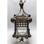 An Art Nouveau copper and glass lantern