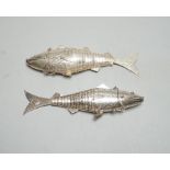 Two continental white metal pill boxes?, both modelled as a articulated fish, both approx. 13.5cm.