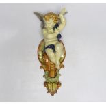 Hughes Protat, a Minton Majolica cherubic wall bracket, incised signature, 42cm high