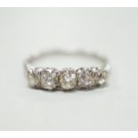 A 1940's white metal and graduated five stone diamond set half hoop ring, size M/N, gross weight 2.8