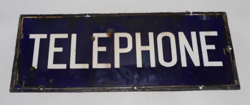 A rectangular enamel double sided ‘telephone’ sign, 56cm x 23cm