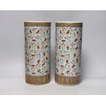 A pair of Chinese famille rose cylindrical vases, decorated with bats, each 29cm high