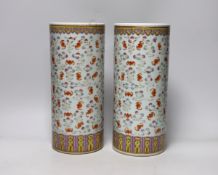 A pair of Chinese famille rose cylindrical vases, decorated with bats, each 29cm high