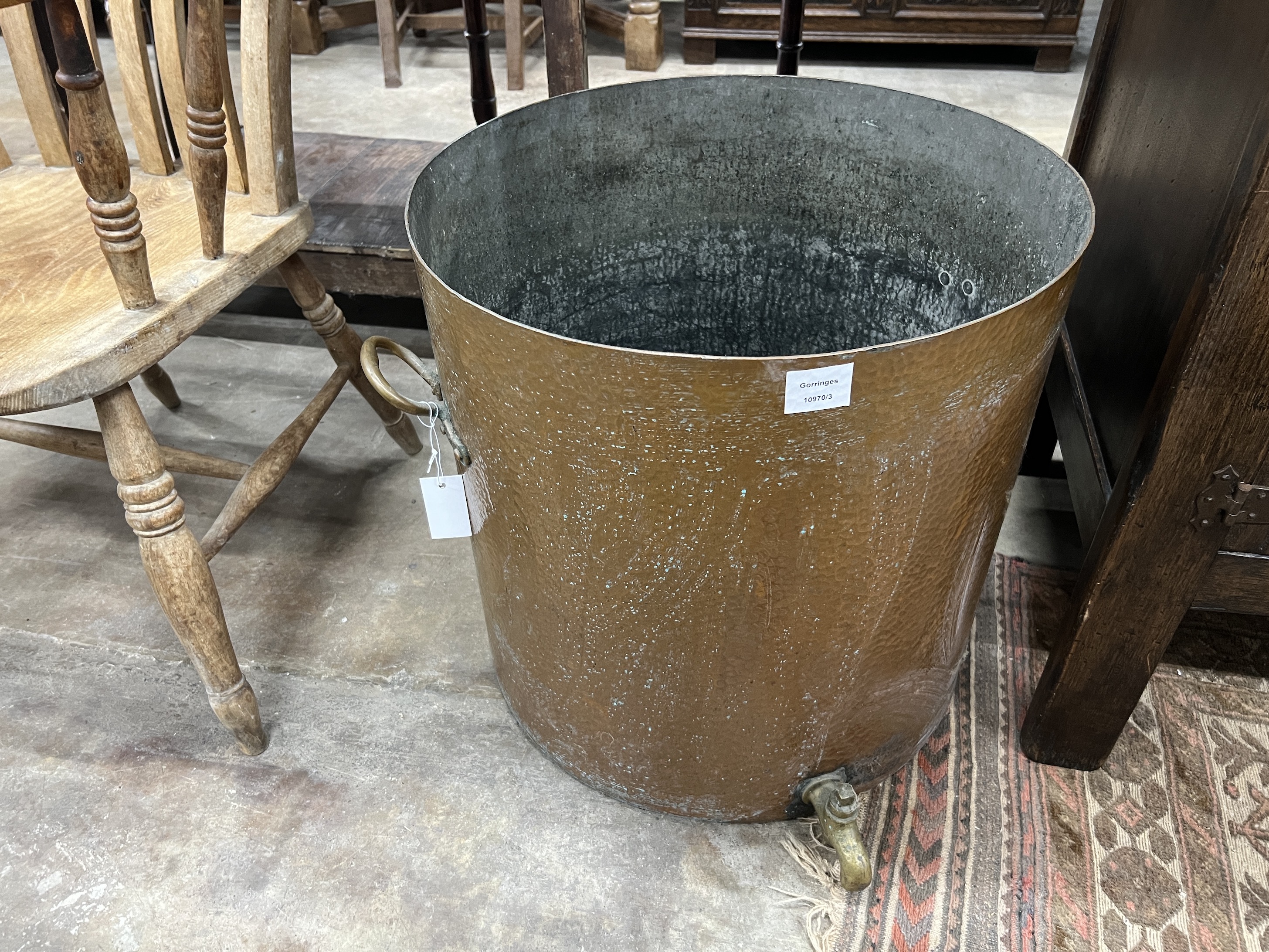 A large Victorian circular hammered copper cauldron with brass spigot, diameter 52cm, height 52cm - Image 2 of 3