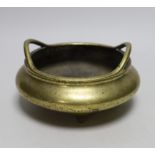 A late 19th century Chinese bronze censer with twin handles, apocryphal Xuande mark, 17.5cm in