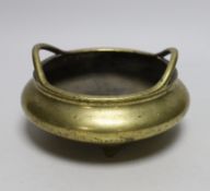 A late 19th century Chinese bronze censer with twin handles, apocryphal Xuande mark, 17.5cm in