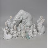 An Herend Polar bear and three sets of four graduated white glazed rabbits and a single green glazed