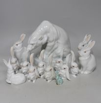 An Herend Polar bear and three sets of four graduated white glazed rabbits and a single green glazed