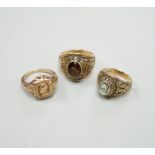 Three assorted American 10k dress rings, two set with gems, one signed John Roberts, gross weight