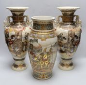 A pair of late 19th century Japanese Satsuma vases and a similar example, the largest each 42cm high