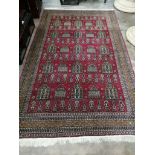 An Azerbaijan red ground rug, circa 1920, 240 x 150cm
