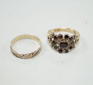 An early 19th century yellow metal, garnet and seed pearl cluster set ring, size P and a 19th