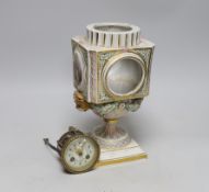 A late 19th century Meissen clock of square form with Watteau scenes and lion mask handles, top