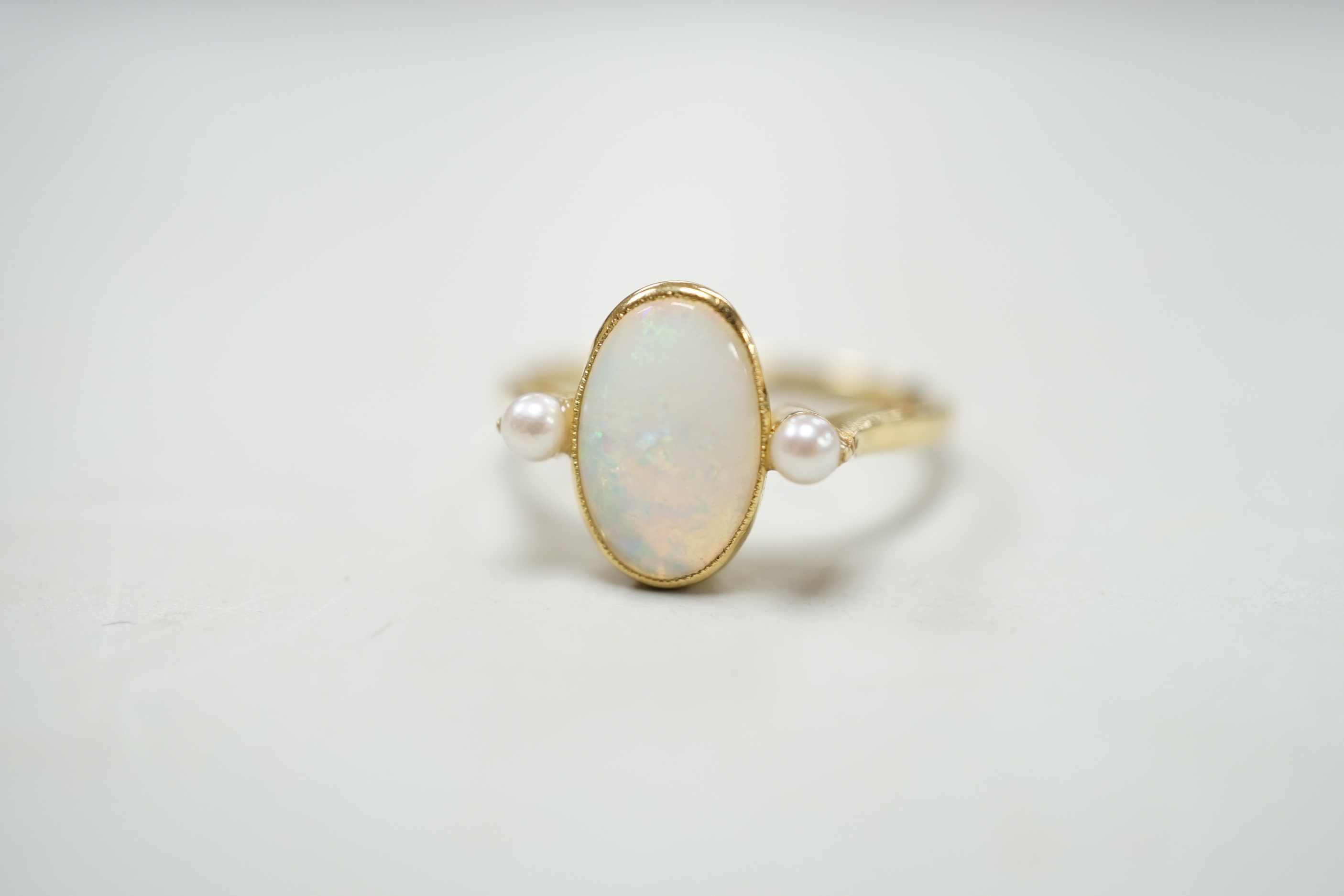 An 18ct, white opal and cultured pearl set three stone ring, size M, gross weight 3.1 grams. - Image 2 of 4