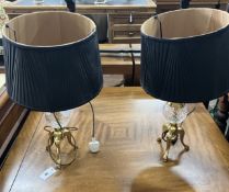A pair of contemporary brass and clear glass tripod table lamps, height including shades 60cm