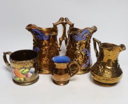 Four Victorian copper lustre jugs and a mug, tallest 21cm (4)