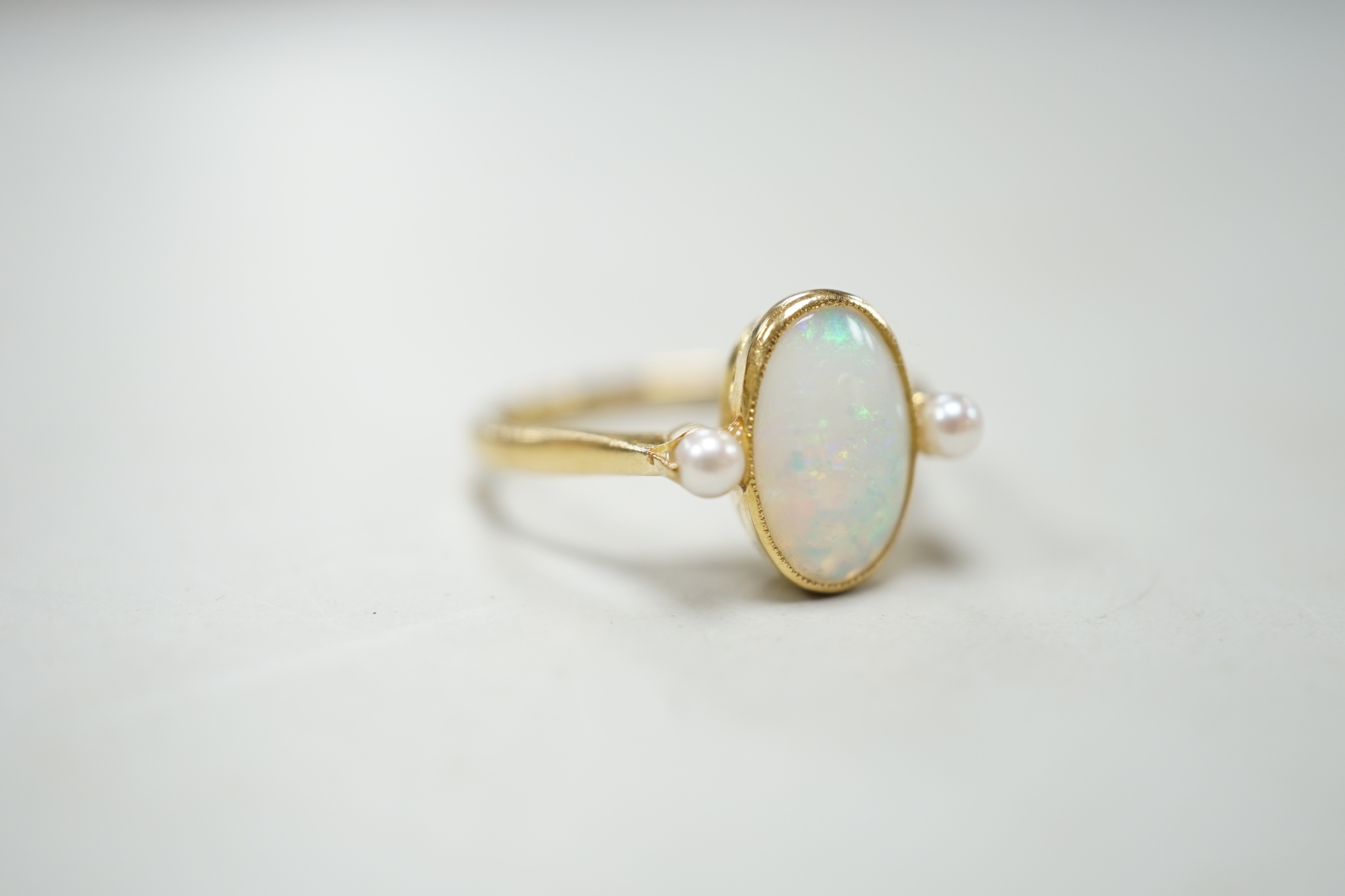 An 18ct, white opal and cultured pearl set three stone ring, size M, gross weight 3.1 grams. - Image 3 of 4