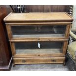 A Globe Wernicke oak two section bookcase with drawer, width 87cm, depth 30cm, height 84cm