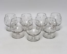 A set of seven cut glass brandy balloon glasses, with pattern of stars to each, 10.5cm high