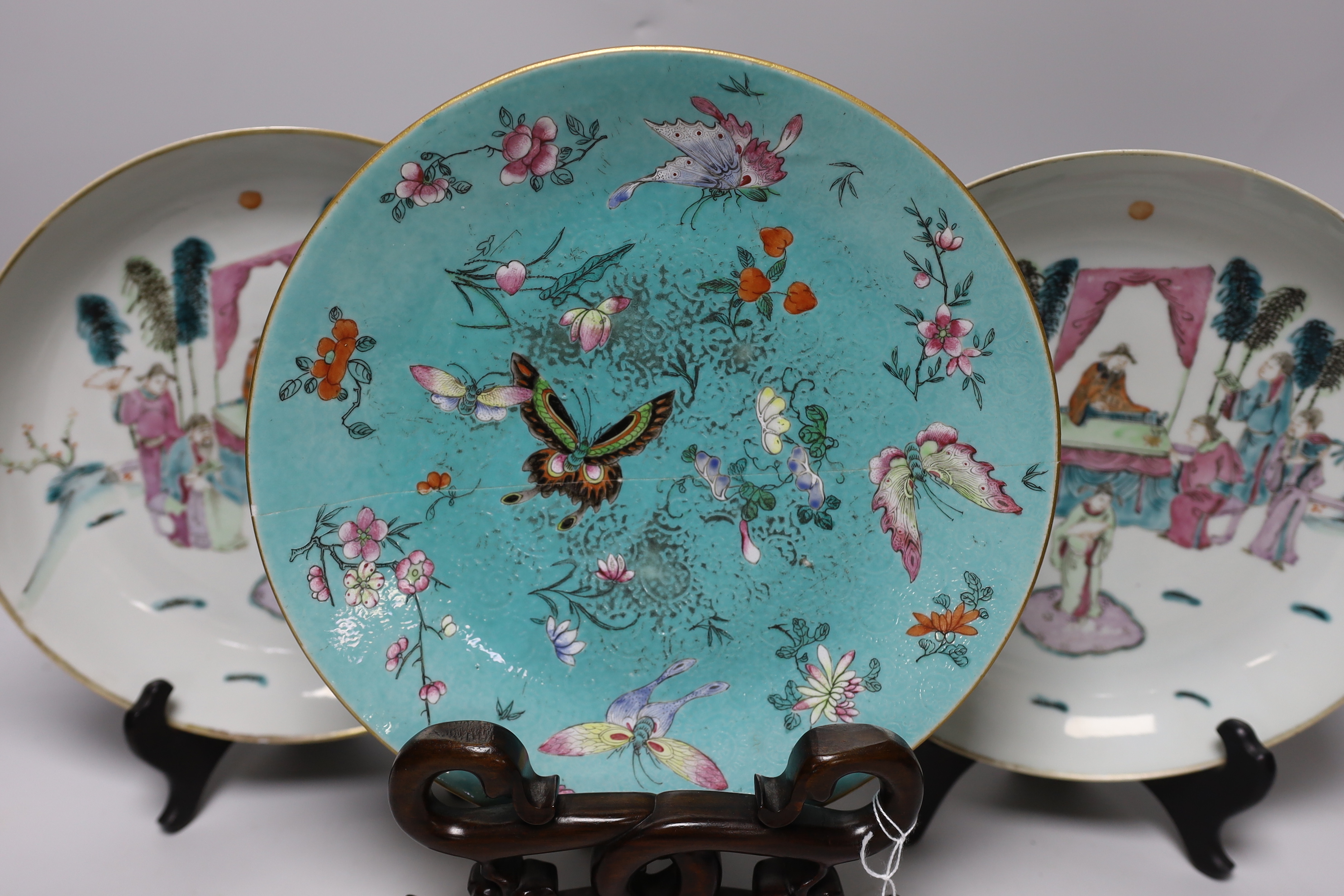 A pair of Chinese famille rose dishes painted with court scenes, a similar enamelled butterfly - Image 3 of 6