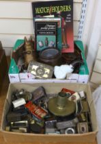 A collection of Vesta boxes, matchbox holders and other related ephemera, mostly metal examples,