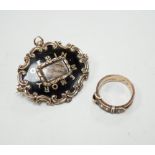 A Victorian 9ct gold, black enamel, plaited hair and seed pearl set mourning buckle ring, size P and