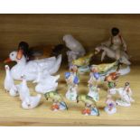Seventeen Herend porcelain bird figures including boy riding a goose and ducks, some with hand