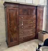 An early Victorian mahogany Beaconsfield wardrobe, width 232cm, depth 61cm, height 196cm