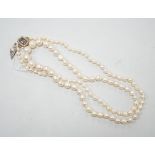 A single strand graduated cultured pearl necklace, now with an earlier 19th century seed pearl and