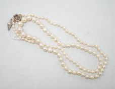 A single strand graduated cultured pearl necklace, now with an earlier 19th century seed pearl and