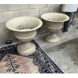 A pair of composition faux stone circular garden planters, diameter 62cm, height 60cm