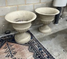 A pair of composition faux stone circular garden planters, diameter 62cm, height 60cm