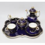 A late 19th century Meissen cabaret set comprising sugar bowl and cover, teapot and cover,