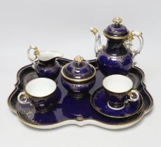 A late 19th century Meissen cabaret set comprising sugar bowl and cover, teapot and cover,