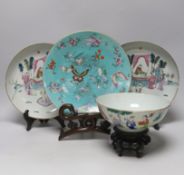 A pair of Chinese famille rose dishes painted with court scenes, a similar enamelled butterfly