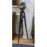 A Bulfinch film set flood lamp formerly gas-powered, on tripod stand