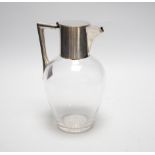 An Edwardian silver mounted glass claret jug, in the manner of Christopher Dresser, Goldsmiths &
