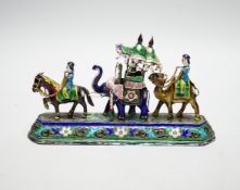 A 20th century Indian white metal and polychrome enamel figural group, with elephants and figures,