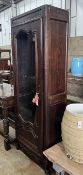 A 19th century French narrow oak armoire, width 62cm, depth 41cm, height 201cm