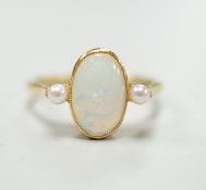 An 18ct, white opal and cultured pearl set three stone ring, size M, gross weight 3.1 grams.