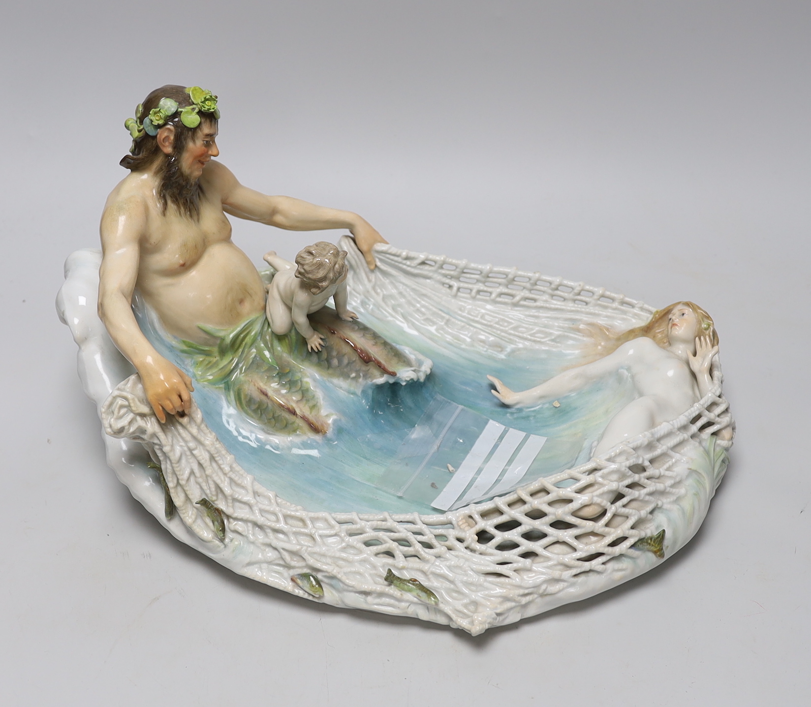 A Meissen group of Triton netting a nymph, early 20th century, modelled by T P Helmig, (a.f.),