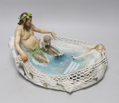 A Meissen group of Triton netting a nymph, early 20th century, modelled by T P Helmig, (a.f.),