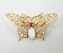 A yellow metal ruby, white opal and seed pearl cluster set bug brooch, width 48mm, gross weight 7
