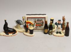 Six Carltonware Guinness advertising models, three related bottles and a rectangular box