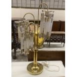 A contemporary brass and perspex three branch table lamp, height 91cm