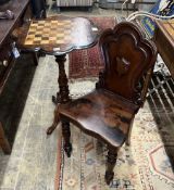 A Victorian mahogany hall chair and a Victorian walnut tripod games table, width 56cm, height 73cm